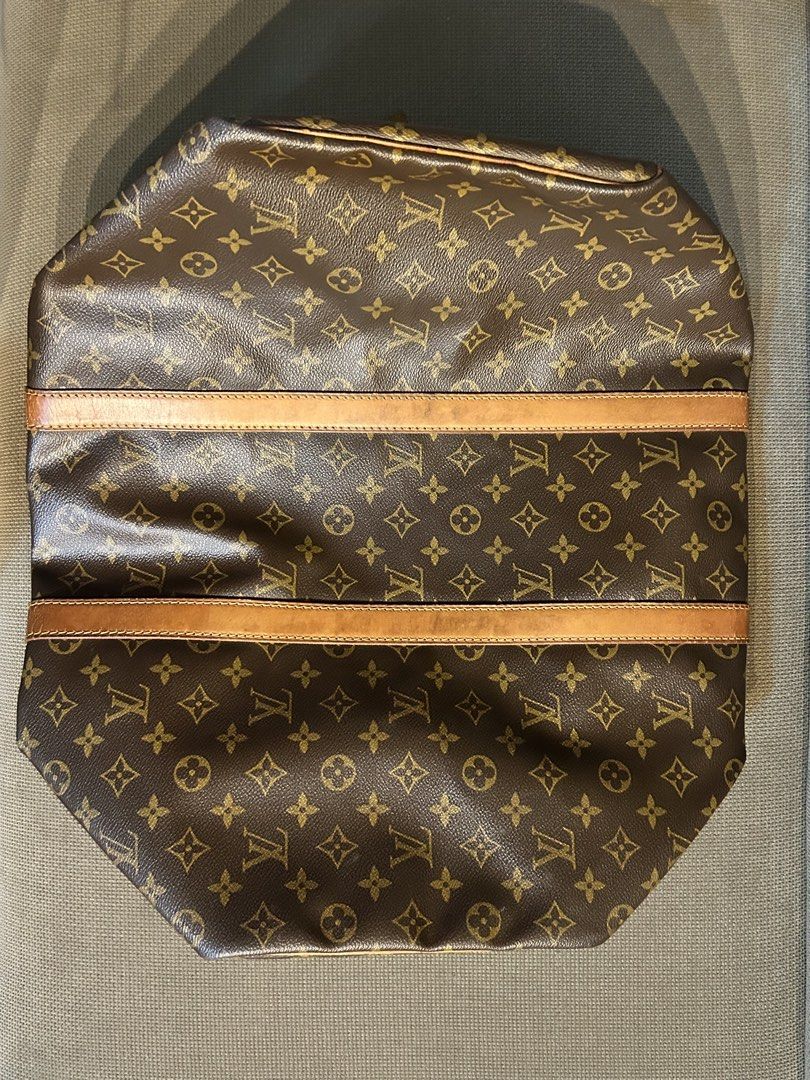 Louis Vuitton Keepall 50 (Category: Luxury Bags & Wallets) located in Quezon City. Submitted by glyndwr27 (Listing ID 1465874757, Image 2). Description: LV Vintage Keepall Condition: Exterior - 10/10 - Canvas still looks vibrant and very clean, leather trim also has developed a honey patina. Interior - 8/10 - Small Stain inside bag as seen in pictures. Inclusions: Comes with Dust Bag & Original Entrupy Certificate of Authenticity. 📍 Location: Va