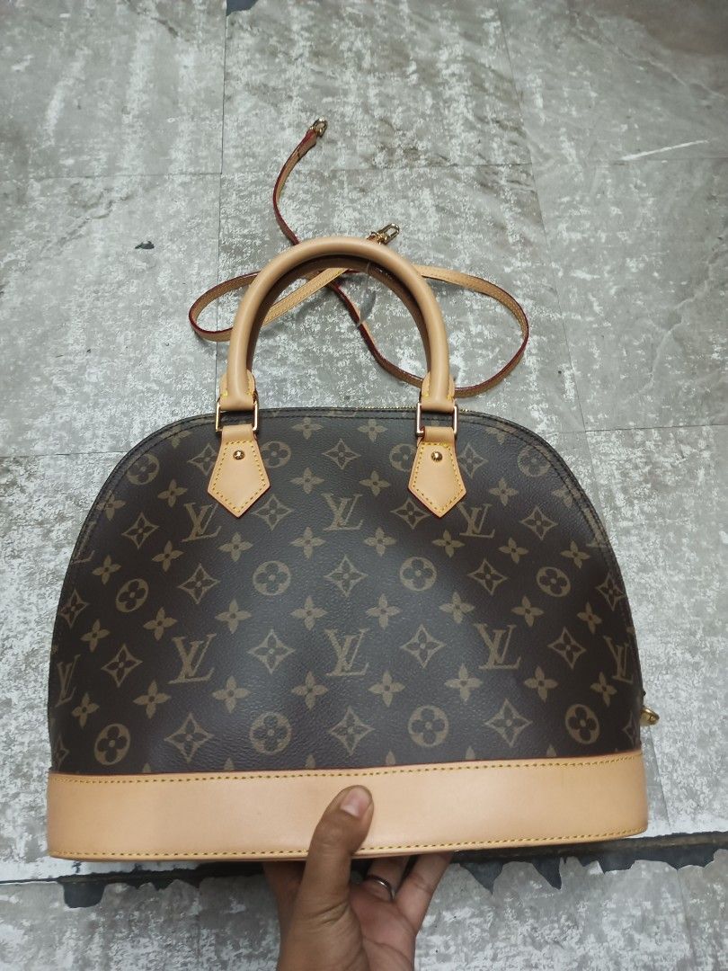 Louis Vuitton Monogram Alma BB Handbag (Category: Luxury Bags & Wallets) located in Baguio. Submitted by brandeditems16 (Listing ID 1465835255, Image 1). Description: - Classic brown monogram canvas with smooth vachetta leather trim - Iconic dome shape with dual top handles and gold-tone hardware - Includes a removable shoulder strap, padlock, and keys - Clean brown fabric interior with a convenient slip pocket - Pristine leather bottom base -Dus