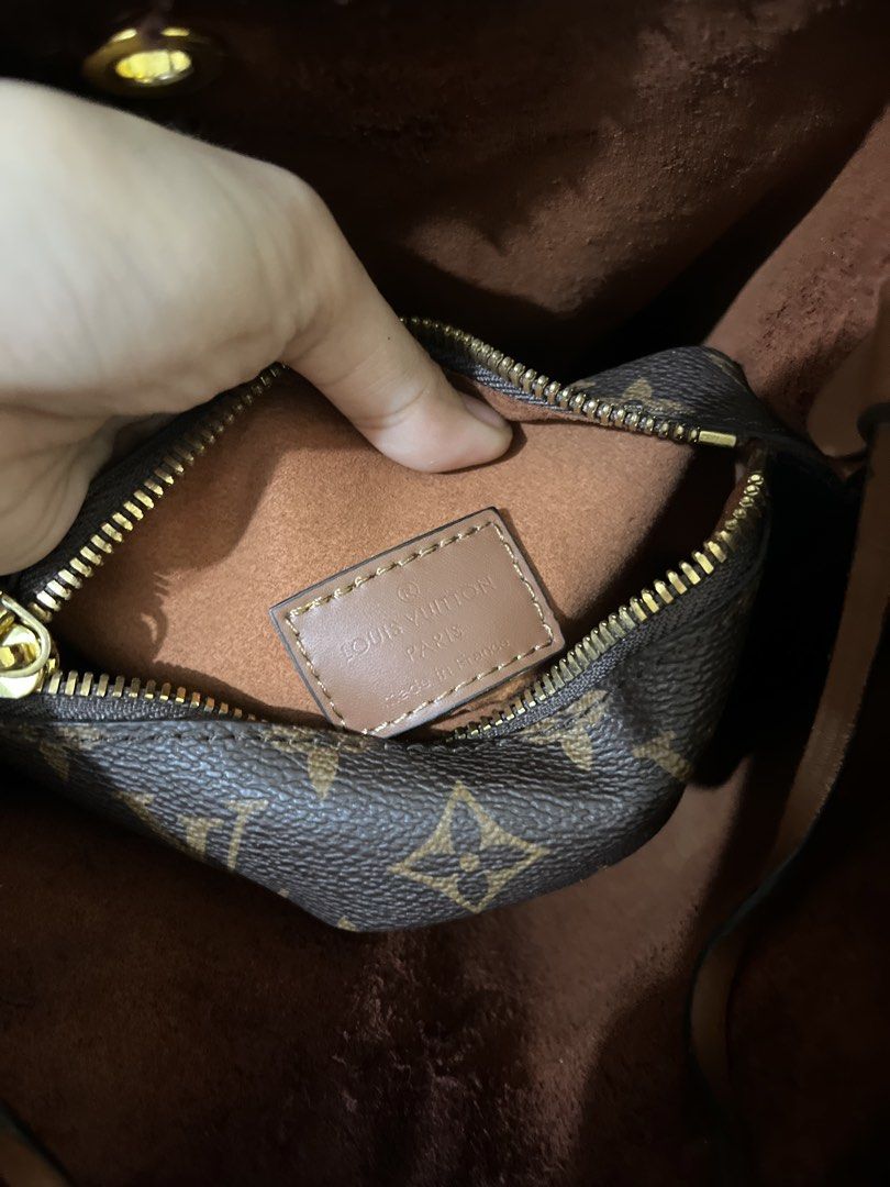 Louis Vuitton Monogram Bucket Bag (Category: Luxury Bags & Wallets) located in Paranaque City. Submitted by yakithings (Listing ID 1465896734, Image 3). Description: - Authentic Louis Vuitton Monogram bucket bag in classic brown canvas - Secure drawstring closure with comfortable brown leather shoulder straps - Gleaming gold-tone hardware - Spacious brown microfiber interior for daily essentials - Includes a matching removable zippered pouch (Mad