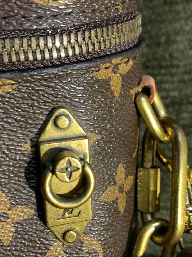 Louis Vuitton Monogram Canvas Vanity Cylinder Bag with Chain Strap (Category: Luxury Bags & Wallets) located in San Juan City. Submitted by findmorelux (Listing ID 1465803182, Image 2). Description: - Louis Vuitton cylindrical vanity bag in classic monogram canvas - Structured design with secure wrap-around top zip closure - Elegant gold-tone hardware featuring a front latch detail - Dual strap options: chunky chain link strap and adjustable brow
