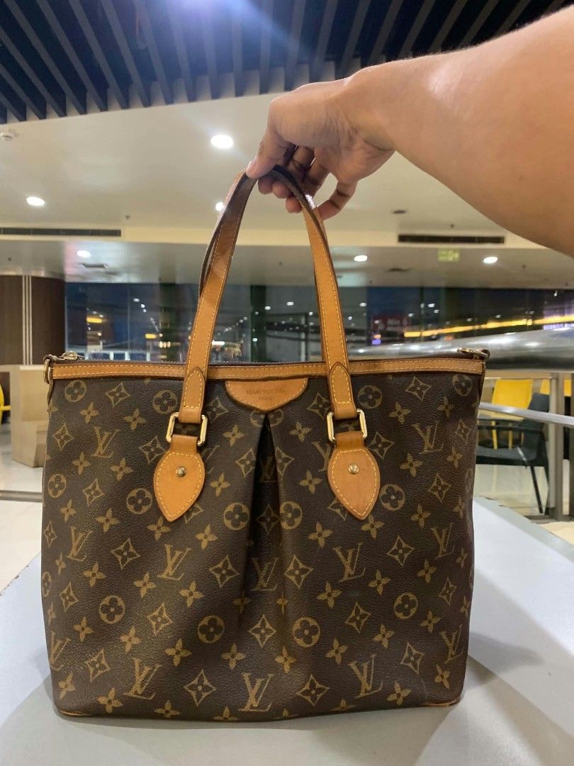Louis Vuitton Monogram Canvas Tote Bag (Category: Luxury Bags & Wallets) located in San Juan City. Submitted by findmorelux (Listing ID 1465805054, Image 2). Description: - Classic Louis Vuitton Monogram canvas design with vachetta leather trim - Secure top zip closure for everyday essentials - Comfortable dual shoulder straps with gold-tone hardware - Stylish pleated front detail with embossed LV Paris leather patch - Includes a charming LV logo