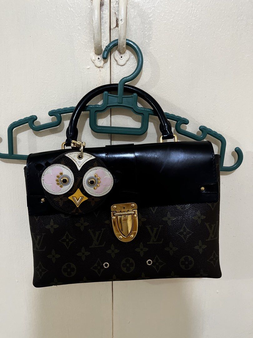 Louis Vuitton Monogram Canvas Handbag with Owl Charm (Category: Luxury Bags & Wallets) located in Paranaque City. Submitted by yakithings (Listing ID 1465896270, Image 1). Description: PAYMENT FIRST - Brand: Louis Vuitton (Made in France) - Material: Classic Monogram canvas with black leather flap and top handle - Hardware: Elegant gold-tone accents with a secure turn-lock closure - Exterior Detail: Adorable, removable playful owl charm near the 