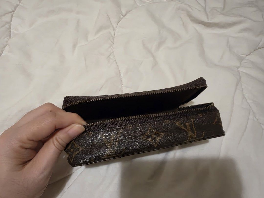Louis Vuitton Monogram Cosmetic Pouch Toiletry Bag (Category: Luxury Bags & Wallets) located in Quezon City. Submitted by thriftshopmar (Listing ID 1465883720, Image 2). Description: - Classic brown monogram canvas exterior - Secure wrap-around zipper opening - Dark brown interior lining with convenient inner zipped pocket - Compact structured rectangular shape - Ideal for travel or organizing daily essentials.