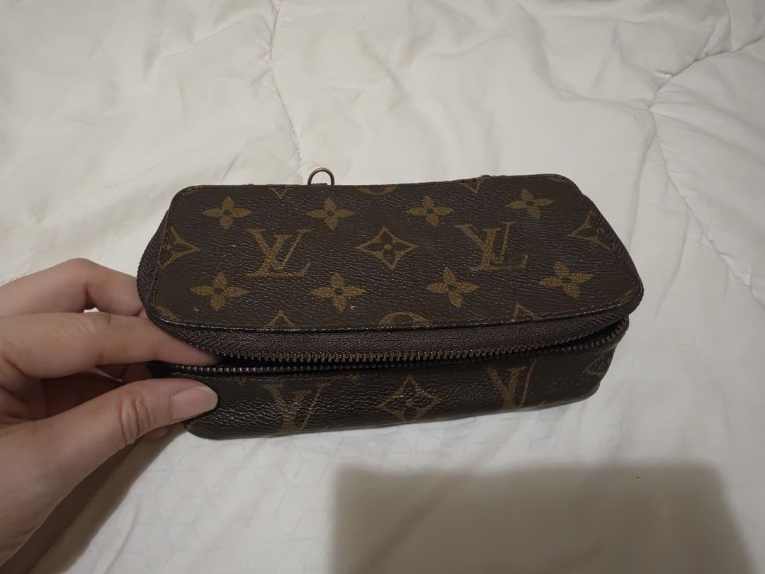 Louis Vuitton Monogram Cosmetic Pouch Toiletry Bag (Category: Luxury Bags & Wallets) located in Quezon City. Submitted by thriftshopmar (Listing ID 1465883720, Image 1). Description: - Classic brown monogram canvas exterior - Secure wrap-around zipper opening - Dark brown interior lining with convenient inner zipped pocket - Compact structured rectangular shape - Ideal for travel or organizing daily essentials.
