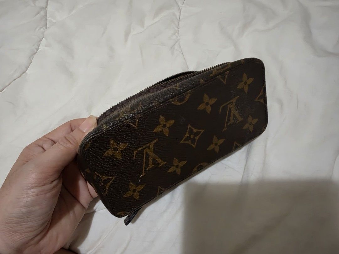 Louis Vuitton Monogram Cosmetic Pouch Toiletry Bag (Category: Luxury Bags & Wallets) located in Quezon City. Submitted by thriftshopmar (Listing ID 1465883720, Image 3). Description: - Classic brown monogram canvas exterior - Secure wrap-around zipper opening - Dark brown interior lining with convenient inner zipped pocket - Compact structured rectangular shape - Ideal for travel or organizing daily essentials.