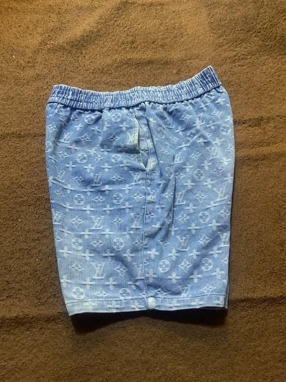 Louis Vuitton Monogram Denim Shorts Blue (Category: Shorts) located in Manila. Submitted by drip-from-thrift (Listing ID 1465953058, Image 2). Description: - Brand: Louis Vuitton - Color: Light blue with all-over monogram pattern - Material: Soft faded denim - Waistband: Elastic with adjustable drawstring for easy pull-on wear - Pockets: Deep functional pockets on both sides - Interior: Features official Louis Vuitton Paris brand tag - Style: Cas