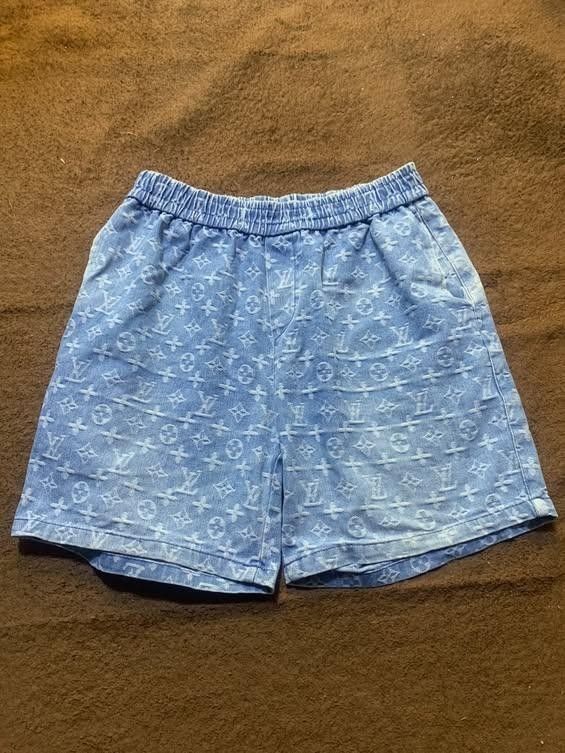 Louis Vuitton Monogram Denim Shorts Blue (Category: Shorts) located in Manila. Submitted by drip-from-thrift (Listing ID 1465953058, Image 1). Description: - Brand: Louis Vuitton - Color: Light blue with all-over monogram pattern - Material: Soft faded denim - Waistband: Elastic with adjustable drawstring for easy pull-on wear - Pockets: Deep functional pockets on both sides - Interior: Features official Louis Vuitton Paris brand tag - Style: Cas