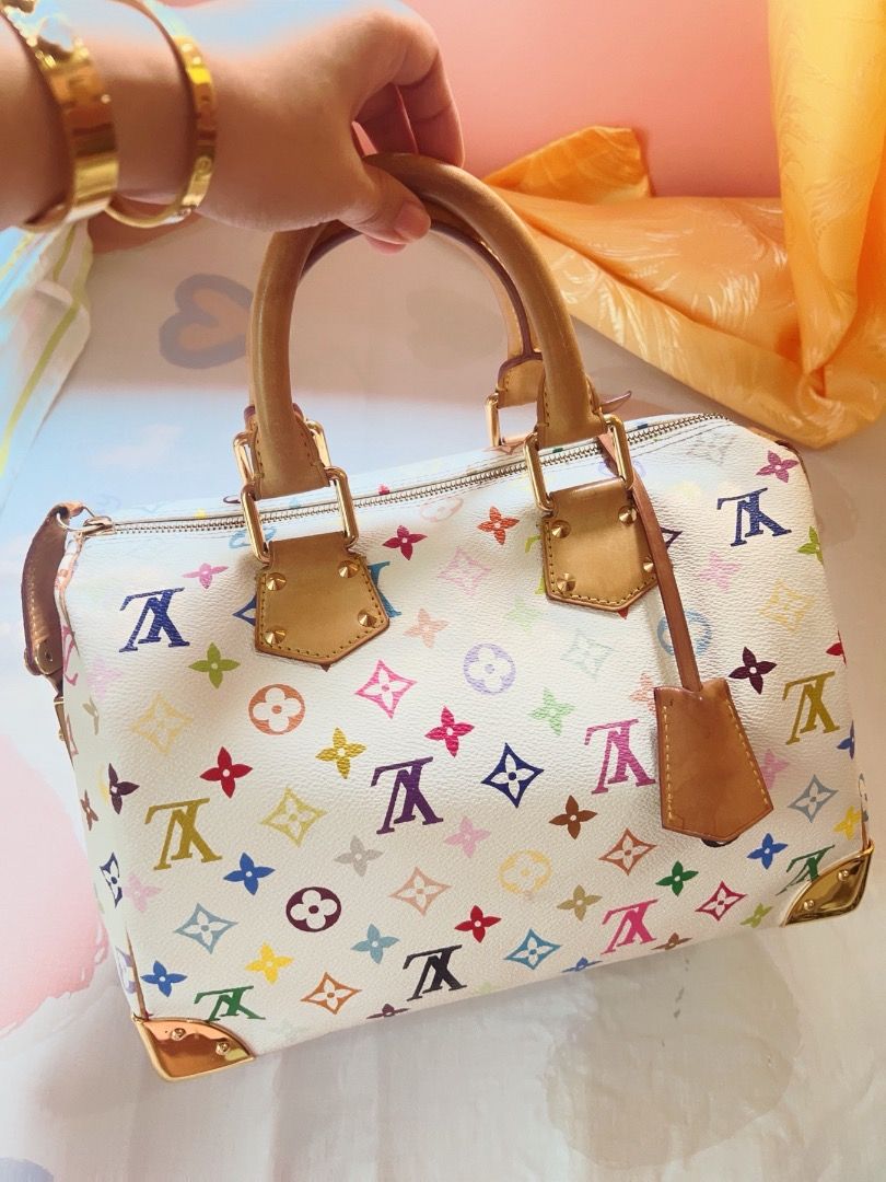 Louis Vuitton Multicolore White Speedy Handbag (Category: Luxury Bags & Wallets) located in Caloocan City. Submitted by sheriesung89940 (Listing ID 1465930503, Image 2). Description: - Authentic Louis Vuitton Monogram Multicolore Speedy bag in classic white - Features the iconic vibrant multicolour monogram print throughout - Crafted with Vachetta leather top handles, trim, and front pocket strap - Stunning gold-tone hardware including corner gua