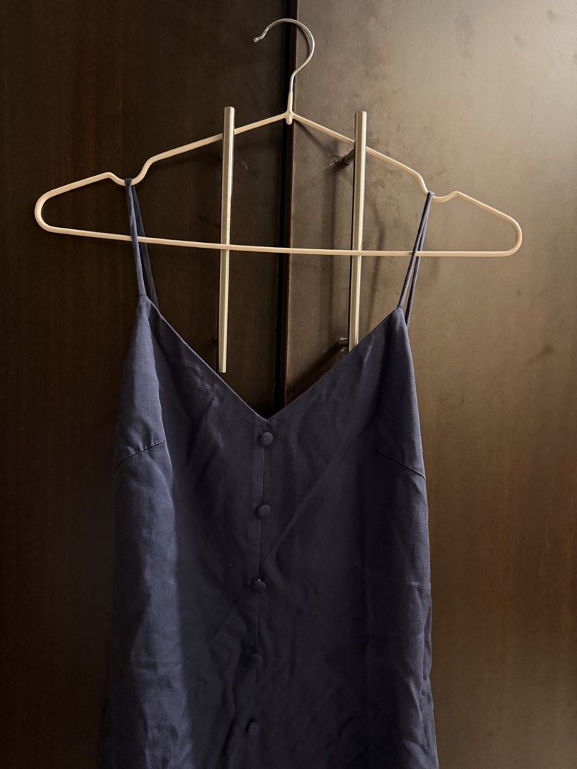 Love, Bonito Arley Button Down Dress Navy (Category: Dresses) located in Mandaluyong City. Submitted by earthtojanne (Listing ID 1465938728, Image 3). Description: - Brand: Love, Bonito - Style: Arley Button Down Dress - Color: Navy Blue - Size: LB XS / UK 6 / US 2 - Design: V-neckline with thin spaghetti straps, front button closure, midi length - Condition/Vibe: Clean, minimalist style that is easy to dress up or down.