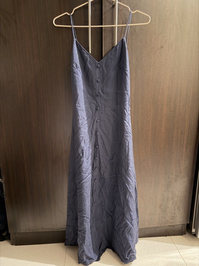Love, Bonito Arley Button Down Dress Navy (Category: Dresses) located in Mandaluyong City. Submitted by earthtojanne (Listing ID 1465938728, Image 2). Description: - Brand: Love, Bonito - Style: Arley Button Down Dress - Color: Navy Blue - Size: LB XS / UK 6 / US 2 - Design: V-neckline with thin spaghetti straps, front button closure, midi length - Condition/Vibe: Clean, minimalist style that is easy to dress up or down.