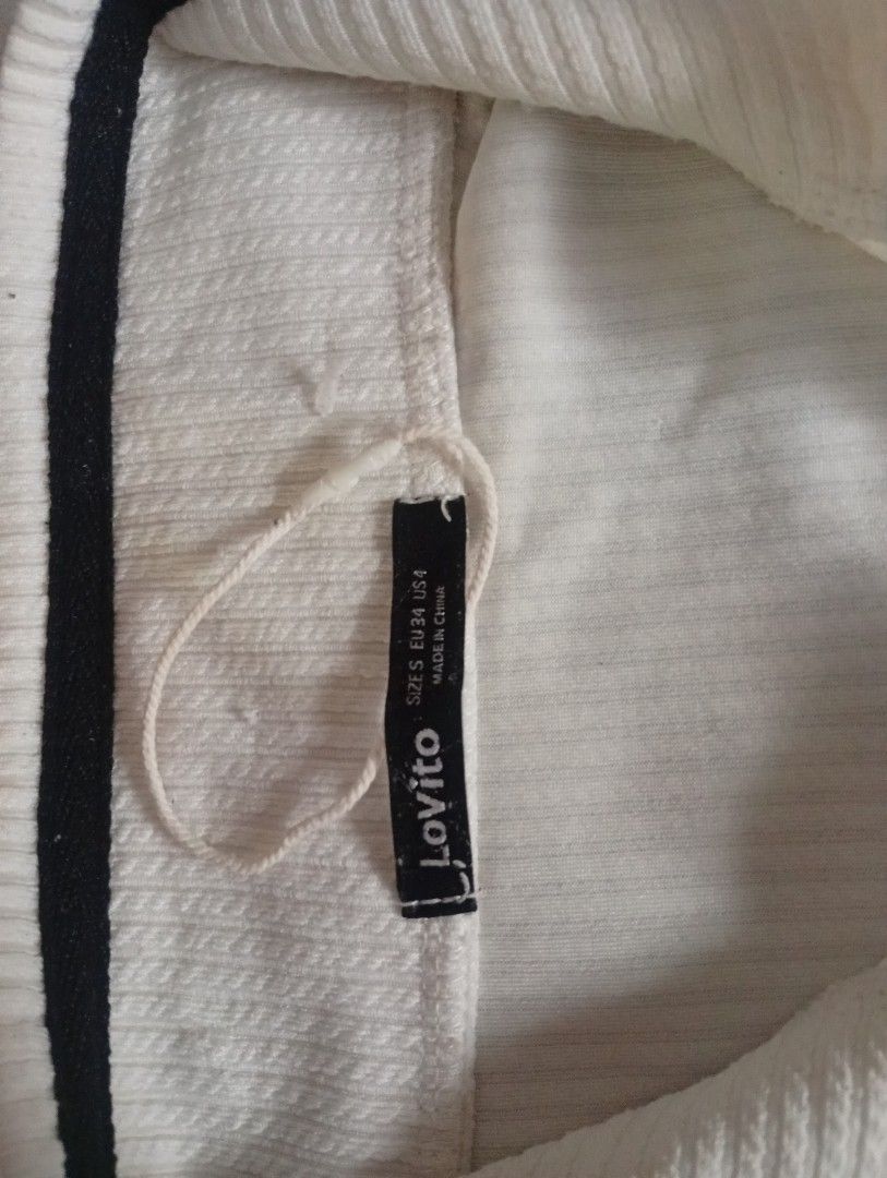 Lovito White Half-Zip Top (Category: Shirts) located in Santa Maria. Submitted by itsmacmacky (Listing ID 1465760676, Image 2). Description: Lovito White Half-Zip Top Brand: Lovito Size: S on tag - fits S-M Made in China Style: Quarter zip, ribbed, short sleeve with black piping Condition: Like new with tag.