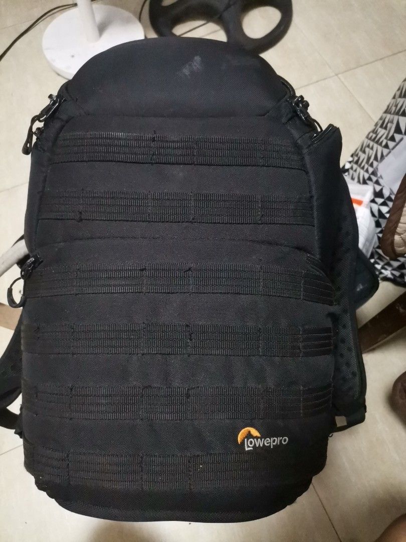 Lowepro ProTactic 350 AW Camera Backpack (Category: Camera Bags & Carriers) located in Makati City. Submitted by kookybearsstuff (Listing ID 1465813259, Image 3). Description: - Model: Lowepro ProTactic 350 AW Camera Backpack (Black) - Comfort: ActivZone mesh back panel for all-day shooting comfort - Customization: Fully adjustable interior dividers to fit your gear securely - Exterior: MOLLE-compatible attachment loops for extra gear - Storage: 