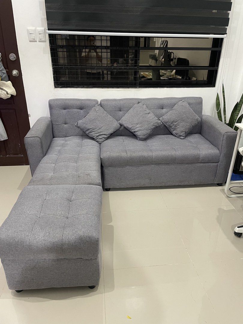 L-shape Sofa (Category: Sofas) located in Quezon City. Submitted by mjnovo (Listing ID 1465912994, Image 3). Description: With some stains, removable since it’s a fabric. Please check the picture. Bought it last July 2026. RFS: Moving out..