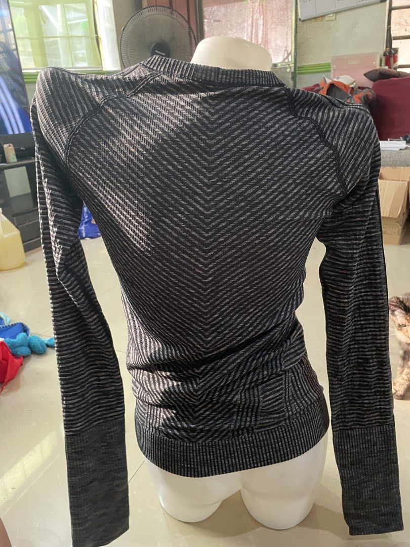 Lululemon Black Grey Striped Long Sleeve Workout Top (Category: Longsleeves) located in Rizal. Submitted by allenrion (Listing ID 1465841261, Image 2). Description: - Brand: Lululemon - Color: Black and grey stripes - Material: Seamless knit fabric with textured chevron patterns - Features: Convenient thumbholes at the cuffs - Size: Flat chest measures approx. 14 inches across - Condition: Great piece, ideal for gym workouts or outdoor running Pr