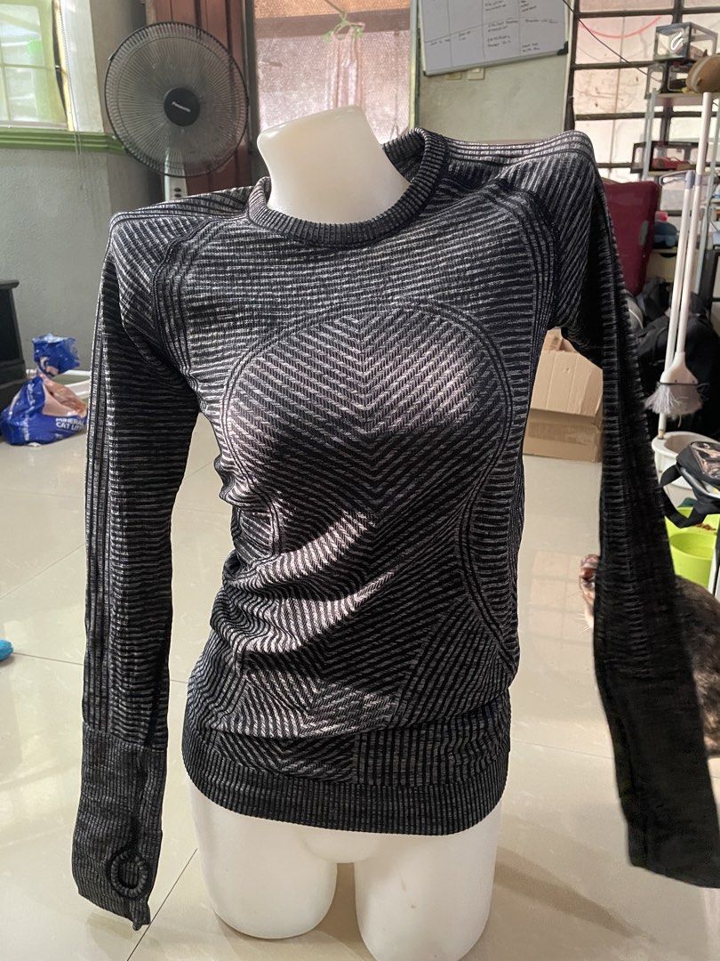 Lululemon Black Grey Striped Long Sleeve Workout Top (Category: Longsleeves) located in Rizal. Submitted by allenrion (Listing ID 1465841261, Image 1). Description: - Brand: Lululemon - Color: Black and grey stripes - Material: Seamless knit fabric with textured chevron patterns - Features: Convenient thumbholes at the cuffs - Size: Flat chest measures approx. 14 inches across - Condition: Great piece, ideal for gym workouts or outdoor running Pr