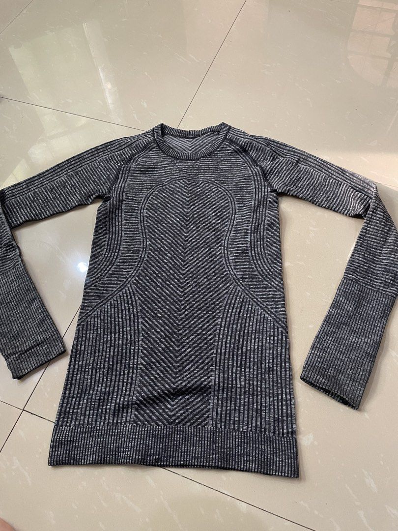 Lululemon Black Grey Striped Long Sleeve Workout Top (Category: Longsleeves) located in Rizal. Submitted by allenrion (Listing ID 1465841261, Image 3). Description: - Brand: Lululemon - Color: Black and grey stripes - Material: Seamless knit fabric with textured chevron patterns - Features: Convenient thumbholes at the cuffs - Size: Flat chest measures approx. 14 inches across - Condition: Great piece, ideal for gym workouts or outdoor running Pr