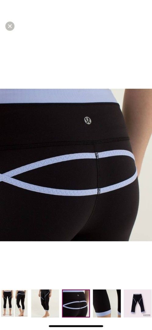 Lululemon Black Light Blue Trim Capri Leggings (Category: Activewear) located in Manila. Submitted by lovelypreloved1497 (Listing ID 1465901537, Image 2). Description: - Brand: Lululemon - Color: Black with light blue contrasting trim - Length: Capri / Calf-length - Features: Reflective logo on back waistband, curve-accentuating back seam - Material: High-stretch, premium activewear fabric - Perfect for: Gym workouts, running, yoga, or casual eve