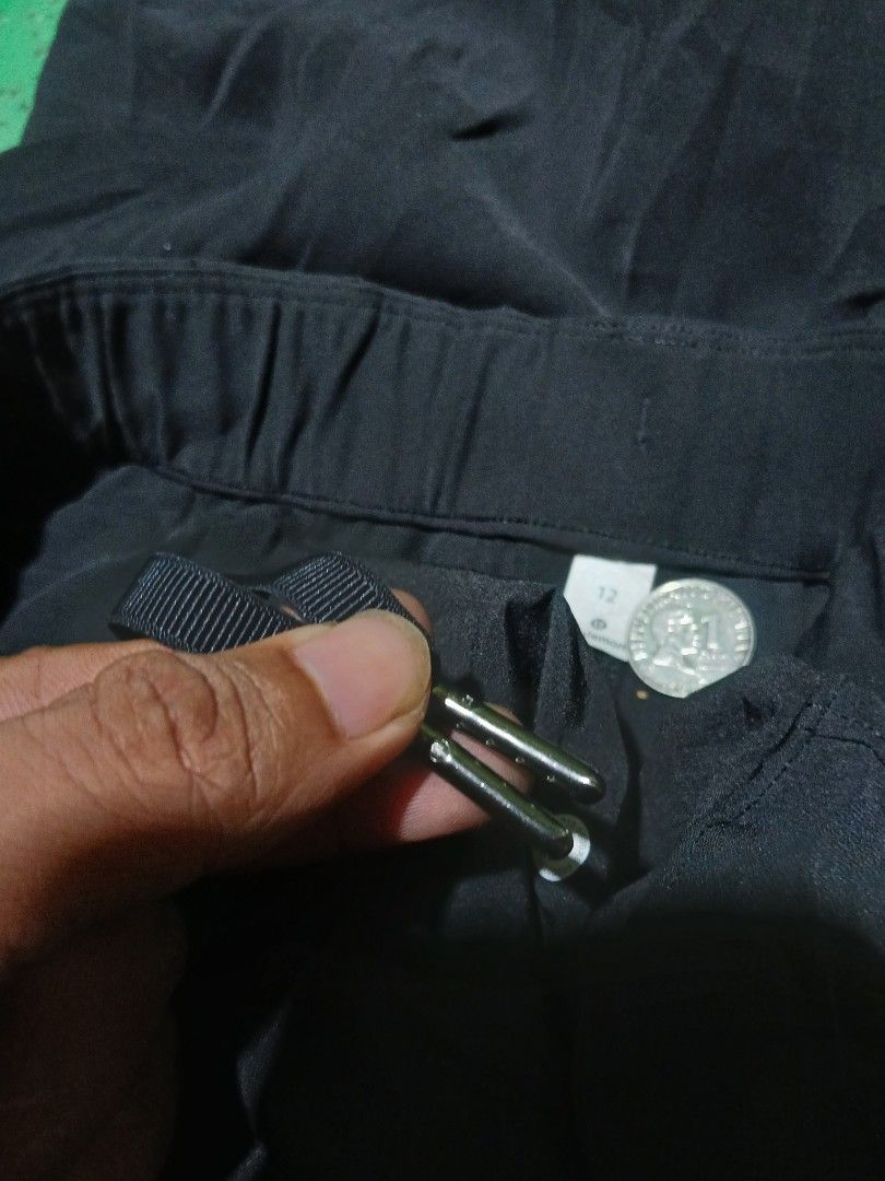 Lululemon on the fly wide leg pants(authentic) (Category: Jeans) located in San Jose. Submitted by garments17 (Listing ID 1465918935, Image 3). Description: - Brand: Lululemon - Color: Solid Black - Size: 12 (Tag attached) - Fit: Relaxed fit through the legs with a wide-leg design - Waist: Mid-rise elastic waistband with adjustable drawstring - Details: Classic subtle Lululemon logo stamped on the leg - Condition: Brand new with tags.