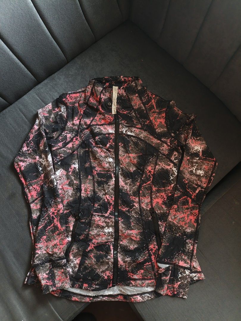 Lululemon Define Jacket Pink Black Abstract Print Size XL (Category: Coats, Jackets and Outerwear) located in Manila. Submitted by jun_thrift (Listing ID 1465866284, Image 1). Description: - Brand: Lululemon - Size: XL - Color/Pattern: Abstract pink, black, and white print - Material: Premium nylon and spandex blend with great stretch - Features: Full-zip front with signature pull, YKK hardware, thumbholes, and secure zip side pockets.