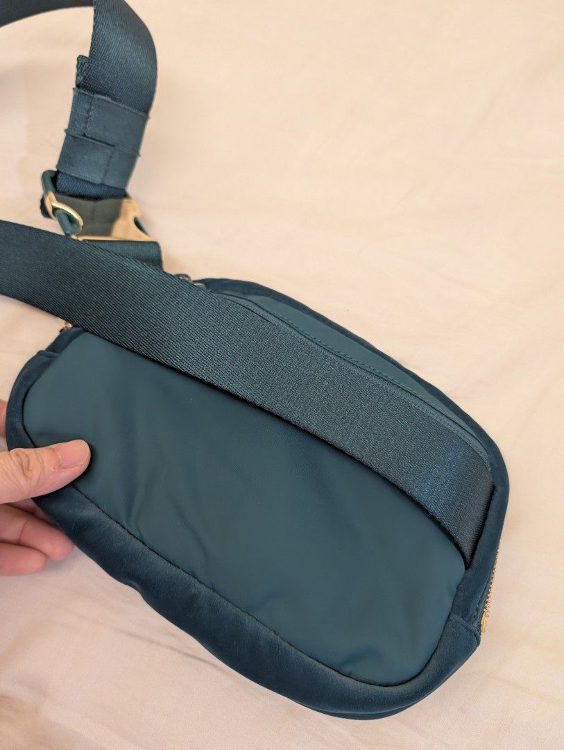 Lululemon Everywhere Belt Bag Velour (Category: Cross-body Bags) located in Mandaluyong City. Submitted by kiraboo (Listing ID 1460121711, Image 3). Description: - Lululemon teal velvet belt bag - Features gold hardware and zipper - Adjustable strap for versatile wear - Ideal for everyday use or travel - Fits phone, wallet, and keys - Can be worn crossbody or around the waist.