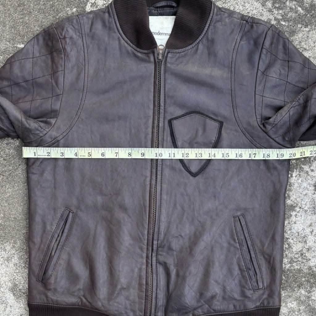(M) MODERNMAN Brown Leather Bomber Jacket Talon Zipper (Category: Coats, Jackets and Outerwear) located in Bantay. Submitted by db_clothing (Listing ID 1465928776, Image 3). Description: - Brand: ModernMAN - Style: Brown leather bomber jacket with quilted sleeve panels and inner pocket on left chest - Hardware: Heavy-duty Talon zipper - Trim: Ribbed collar, cuffs, and hem - Condition: Excellent pre-loved condition - Mode of Payment: GCash or BDO 
