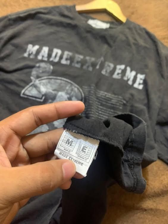 Made Extreme Basketball Graphic Tee Size M (Category: Tshirts & Polo Shirts ) located in San Jose del Monte. Submitted by dripfromthrift2 (Listing ID 1465952695, Image 2). Description: - Brand/Model: Made Extreme - Color: Washed black with a worn-in fade - Size: Medium (tag on collar) - Design: Large basketball graphic with distressed lettering - Material: Heavy cotton - Cut: Short sleeves, standard crew neck.
