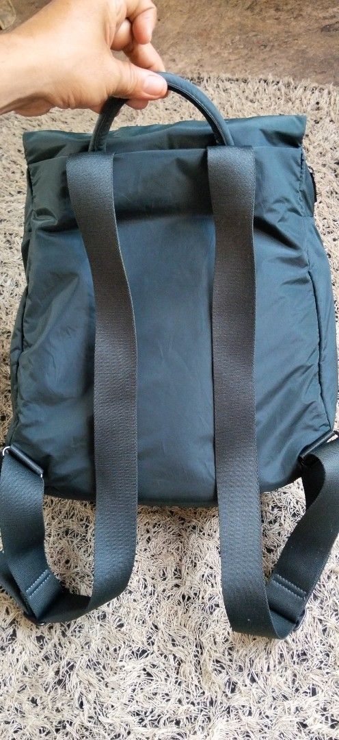 Mandarina Duck Dark Green Nylon Backpack (Category: Backpacks) located in Paranaque City. Submitted by michael-08 (Listing ID 1465897314, Image 2). Description: - Brand: Mandarina Duck - Color: Dark Green - Material: Soft, durable nylon - Compartments: Zippered main compartment and front pocket for easy organization - Comfort: Adjustable shoulder straps and padded top handle - Details: Subtle brand logo printed on the handle - Condition: Clean in