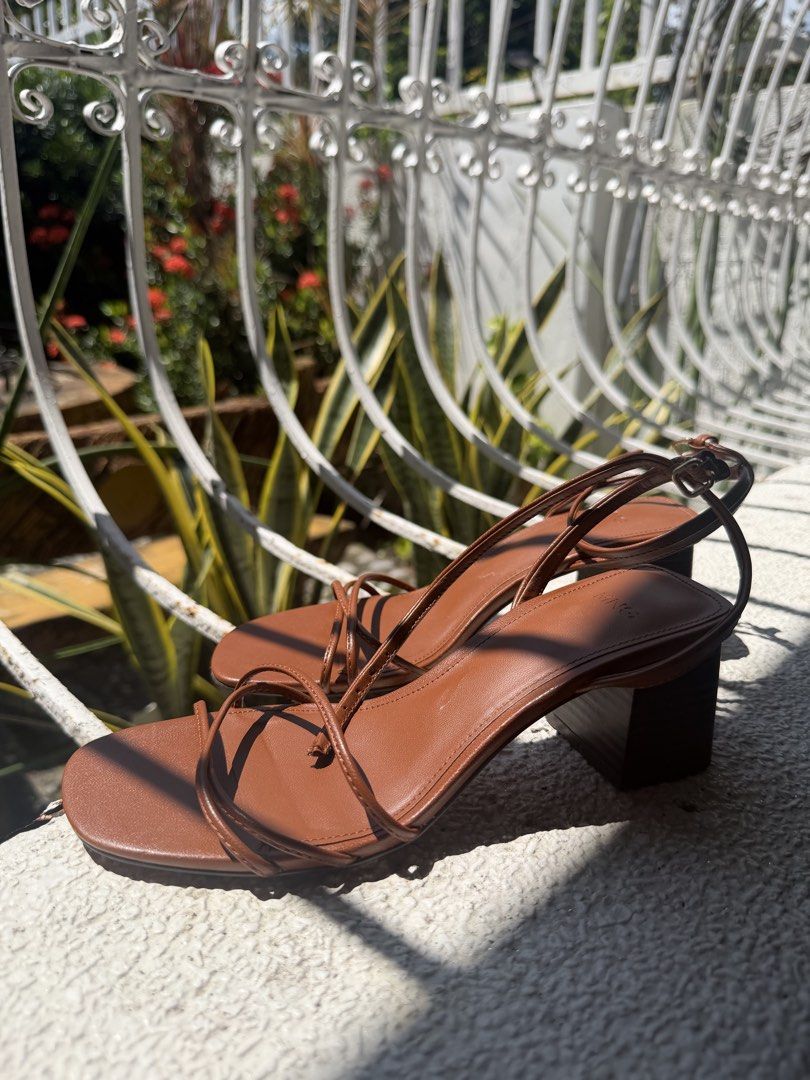 Mango Brown Strappy Block Heel Sandals (Category: Heels) located in Taguig. Submitted by anjielamarie_ (Listing ID 1465775873, Image 2). Description: Used once only - Brand: Mango - Color: Brown - Design: Square toe with multiple thin straps and ankle buckle closure - Heel: Sturdy block heel for all-day comfort - Versatility: Ideal for casual outings or dinners - Condition: Clean and well-maintained.