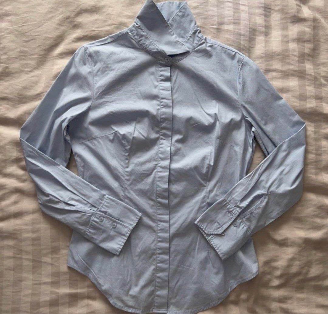MANGO Light blue Button-up Collared Long Sleeve Shirt (Category: Longsleeves) located in Pasig City. Submitted by jenscloset86 (Listing ID 1465926269, Image 1). Description: Brand: MANGO Size: SMALL • Used TWICE. Consider it new. • A bit stretch fabric • No flaws, no damages. Dimension: Length: 26” Shoulder: 15” Bust: 36” Waist: 30” Sleeve: 23” - Mango light blue button-up shirt - Comfortable cotton and elastane blend - Stylish high collar - Butt