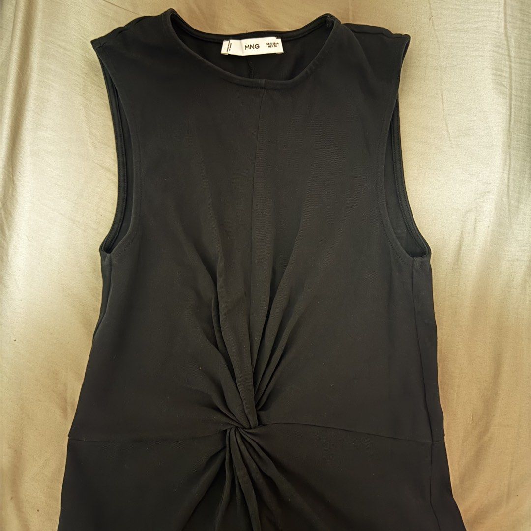 Mango Size S Black KNOTTED COTTON DRESS (Category: Dresses) located in Muntinlupa City. Submitted by decluttering22.22 (Listing ID 1465897407, Image 3). Description: As good as new. - Brand: Mango - Size: S (EUR S, USA 4) - Color: Black - Design: Sleeveless with a round neckline and stylish front twist knot detail - Fit: Straight skirt midi length with a back slit for easy movement.