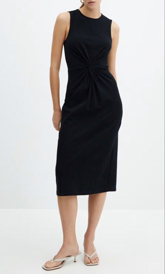 Mango Size S Black KNOTTED COTTON DRESS (Category: Dresses) located in Muntinlupa City. Submitted by decluttering22.22 (Listing ID 1465897407, Image 1). Description: As good as new. - Brand: Mango - Size: S (EUR S, USA 4) - Color: Black - Design: Sleeveless with a round neckline and stylish front twist knot detail - Fit: Straight skirt midi length with a back slit for easy movement.