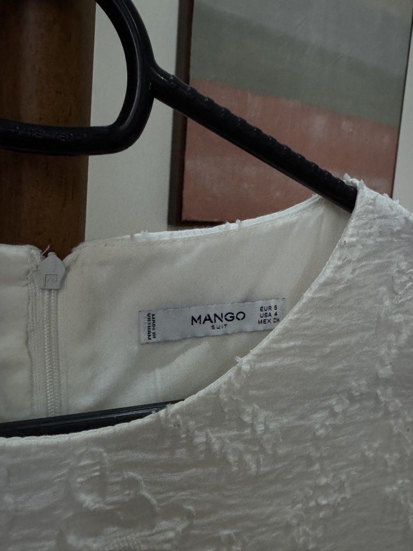 Mango White Sleeveless Dress Size S (Category: Dresses) located in Pasig City. Submitted by kutleyn (Listing ID 1465760110, Image 3). Description: - Brand: Mango - Style: Sleeveless mini dress - Color: White with textured patterned fabric - Details: Round neckline, back zipper closure, fully lined - Size: EUR S, USA 4, MEX CH - Condition: Clean, excellent, and ready to wear.