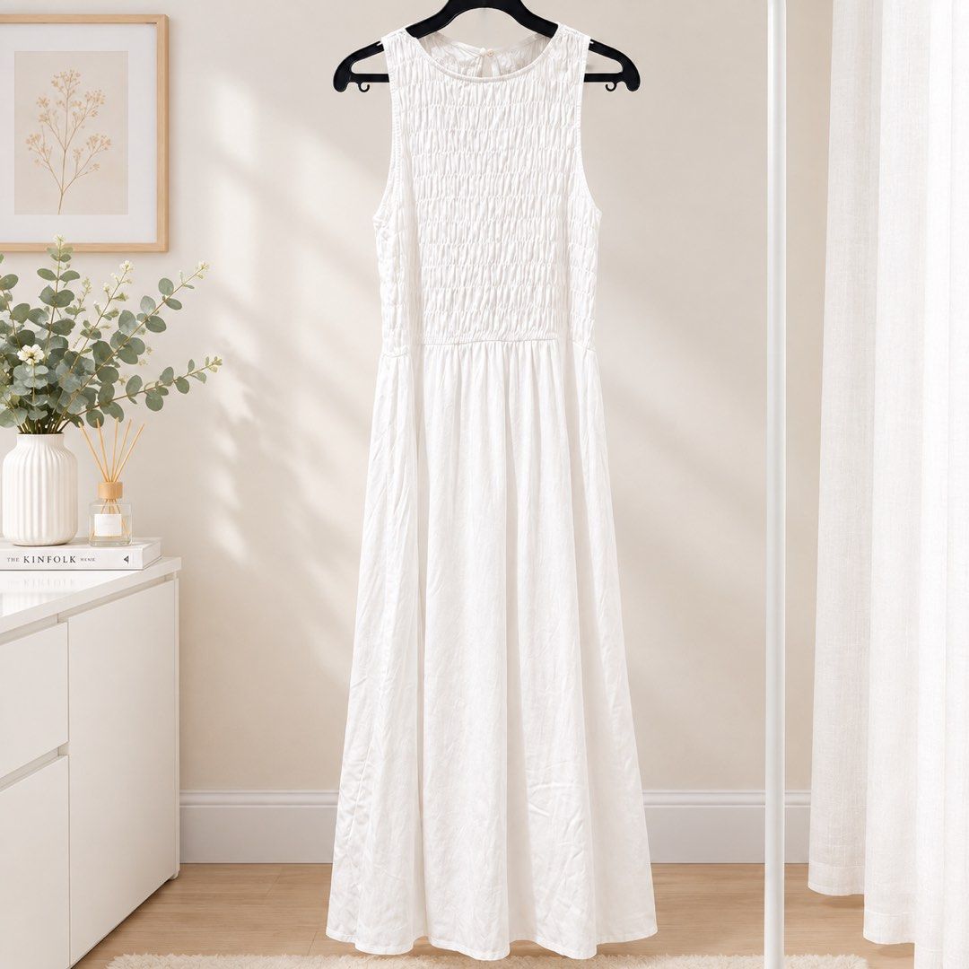 Mango White Smocked Midi Dress Size S (Category: Dresses) located in Marikina City. Submitted by preloved_n_reloved (Listing ID 1465828574, Image 1). Description: - Brand: Mango - Color: White - Size: EUR S / USA S - Design: Sleeveless with a fully smocked bodice and relaxed flare skirt - Origin: Made in Bangladesh - Material: Lightweight fabric, ideal for warm weather - Condition: Clean and well-maintained.