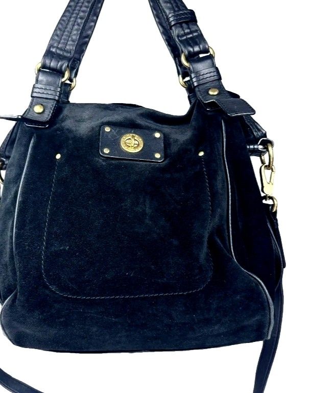 Marc by Marc Jacobs black suede handbag (Category: Cross-body Bags) located in Manila. Submitted by lene48 (Listing ID 1465760973, Image 1). Description: - Brand: Marc by Marc Jacobs - Material: Luxurious black suede with smooth leather trim - Hardware: Elegant gold-tone details - Closure: Secure zip top closure - Pockets: Convenient front pocket with gold turn-lock closure, plus interior and exterior pockets - Straps: Dual leather top handles an