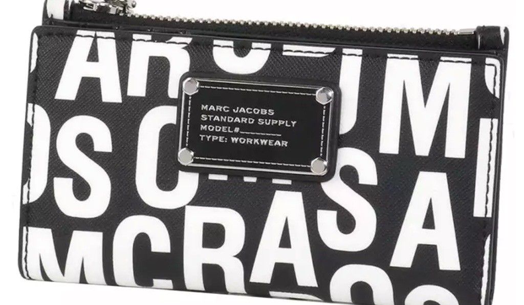 Marc Jacobs Standard Supply Workwear Wallet Black White (Category: Wallets & Card holders) located in Manila. Submitted by keirye (Listing ID 1465773926, Image 1). Description: - Brand: Marc Jacobs (Original!!!) - Color: Classic black with bold white lettering - Storage: Top zipper pocket for secure essentials - Details: Front metal branding plate reading "Standard Supply, Type Workwear" - Design: Sleek, monochromatic, and compact to fit easily i