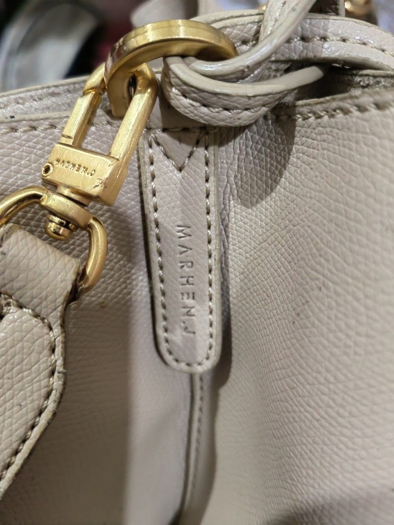 Marhen.J Beige Bucket Bag with Drawstring and Charm (Category: Shoulder Bags) located in Makati City. Submitted by prelovedtreatedwithlove (Listing ID 1465830547, Image 3). Description: - Brand: Marhen.J - Color: Versatile neutral beige - Material: Textured faux leather with elegant gold hardware - Closure: Secure top drawstring - Interior: Open compartment with a convenient side pocket - Includes: Matching brand charm on the strap - Condition: M