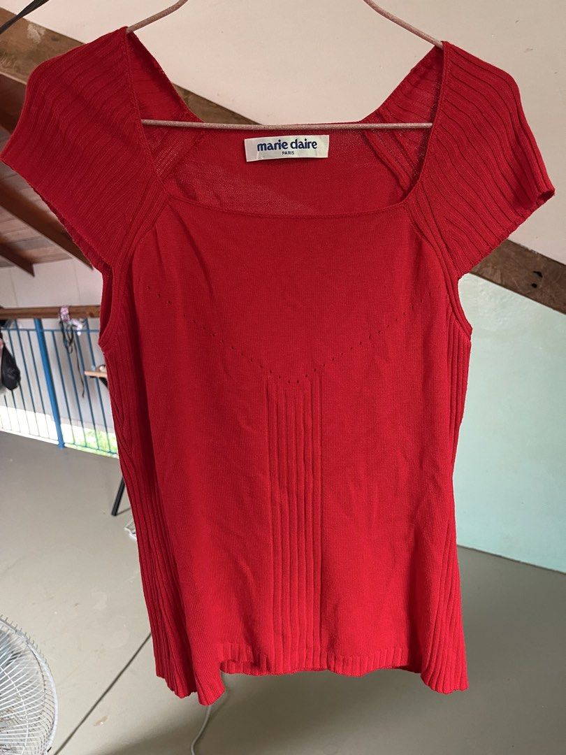 Marie Claire Paris Red Knit Top (Category: Blouses) located in Baybay. Submitted by shikita27906 (Listing ID 1465849314, Image 1). Description: - Brand: Marie Claire Paris - Color: Bright red - Neckline: Square neck with short sleeves - Design: Pointelle stitch V-shape pattern across the chest - Texture: Ribbed details on shoulders, sides, and front center - Fit: Soft, comfortable knit fabric.