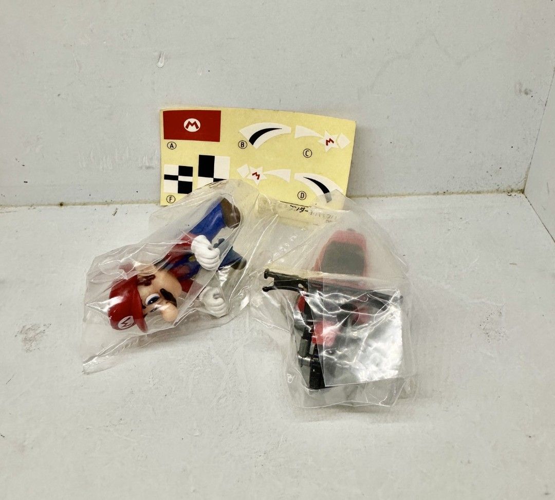 Mario Kart Pull Back Racing Collection Mario Standard Bike (Category: Vehicle & Diecast Models) located in Manila. Submitted by minihobbies23 (Listing ID 1465833146, Image 1). Description: - Authentic Takara Tomy Mario Kart Wii Racing Collection 2 - Includes Mario and Standard Bike figure set - Brand new and 100% unopened in original clear plastic packaging - With original sticker sheet.