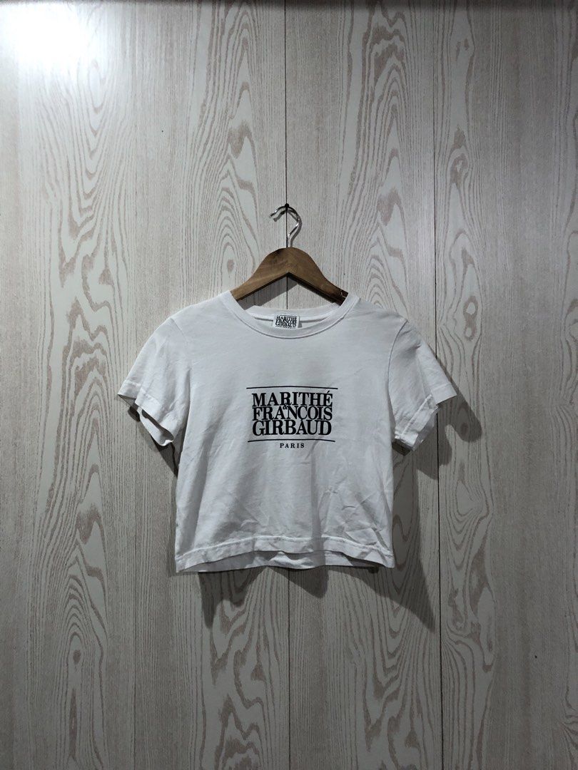Marithe Francois Girbaud White Crop T-Shirt (Category: Shirts) located in Magsaysay. Submitted by ryns_thrifting (Listing ID 1465894533, Image 1). Description: - Brand: Marithé François Girbaud - Item: White cropped t-shirt with bold black chest logo - Size: S (Tag fit: Height 160-170cm, Chest 86-90cm) - Material: 100% breathable cotton - Condition: Clean, fresh white colorway - Styling: Perfect to pair with high-waisted jeans, shorts, or skirts 
