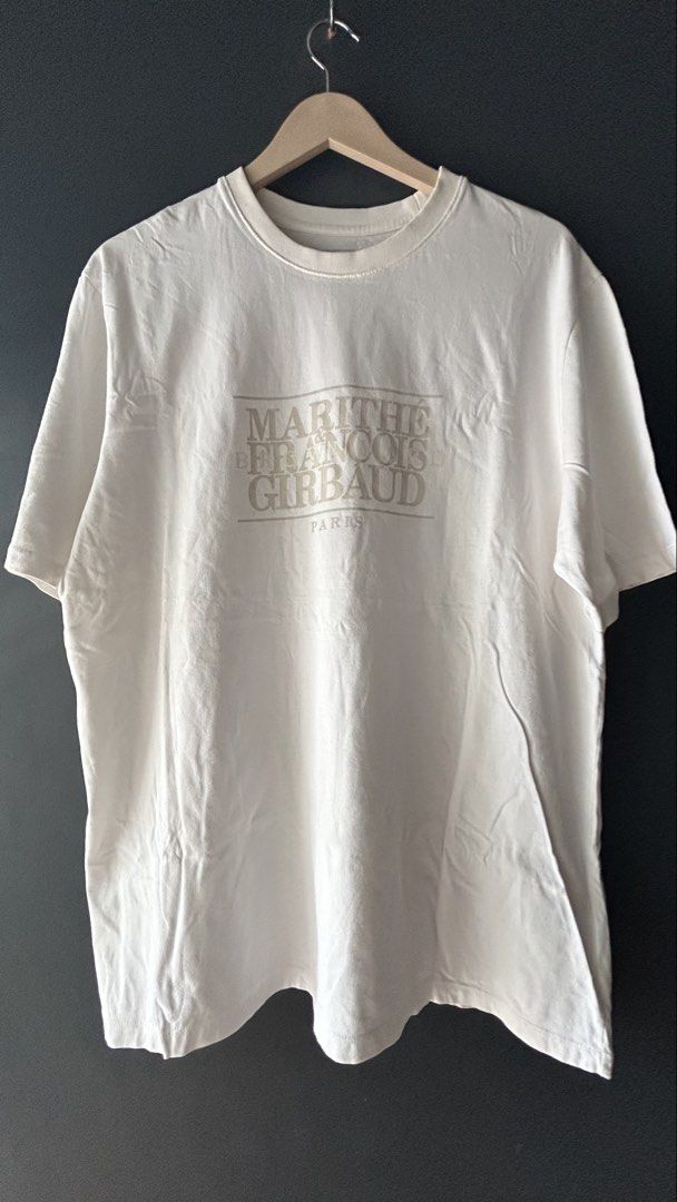 Marithe Francois Girbaud x Brownyard White Tee (Category: Tshirts & Polo Shirts ) located in General Santos City (Dadiangas). Submitted by moana_thrifts (Listing ID 1465829869, Image 1). Description: - Brand/Collab: Marithé François Girbaud x Brownyard - Design: Classic crewneck with large logo printed on the chest - Color: White - Size: Tag 4 - Material: 100% cotton - Condition: Clean, worn just a few times, no stains or damage.
