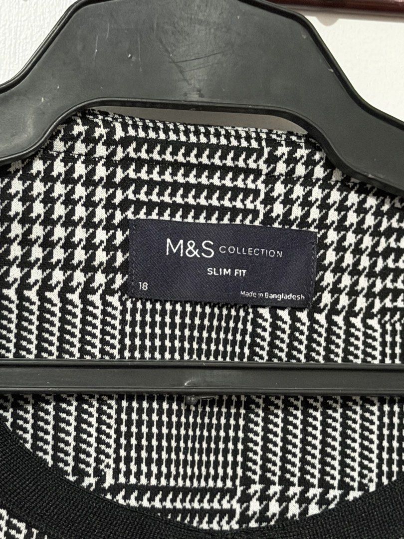 Marks & Spencer Collection Houndstooth Slim Fit Jacket Size 18 (Category: Coats, Jackets and Outerwear) located in Las Pinas. Submitted by milkydeclutter (Listing ID 1465938465, Image 2). Description: - Brand: Marks & Spencer - Style: Open front slim-fit blazer with contrasting black trim - Pattern: Classic black and white houndstooth - Size: UK 18 - Origin: Made in Bangladesh - Condition: Clean, well-kept, and without visible flaws.