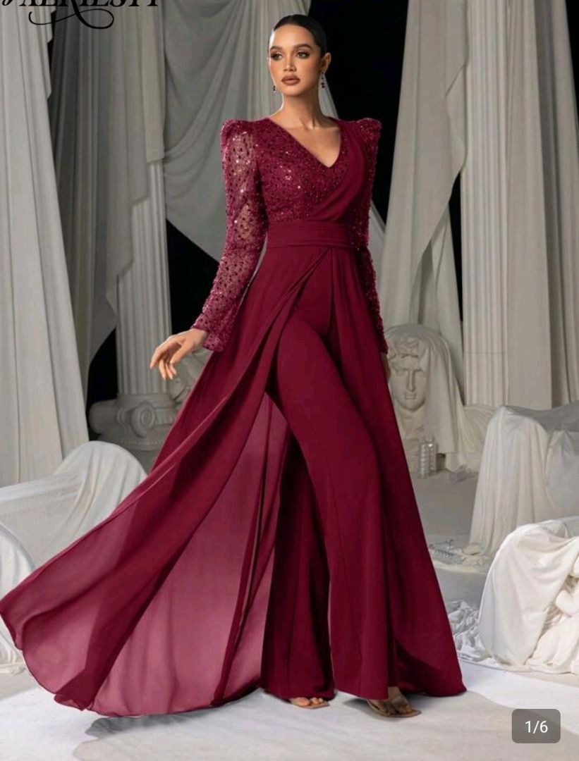 Maroon Sequenced Long Sleeve Jumpsuit with Chiffon Overlay (Category: Jumpsuits) located in Marikina City. Submitted by julysapparel_40 (Listing ID 1465825455, Image 1). Description: - Color: Maroon - Style: Long sleeve jumpsuit with a flowing chiffon gown overlay and wide-leg trousers - Details: Sparkling sequins on the bodice and sleeves, V-neck cut, and fitted waistline - Movement: Creates a dramatic and elegant flow when walking - Occasion: I
