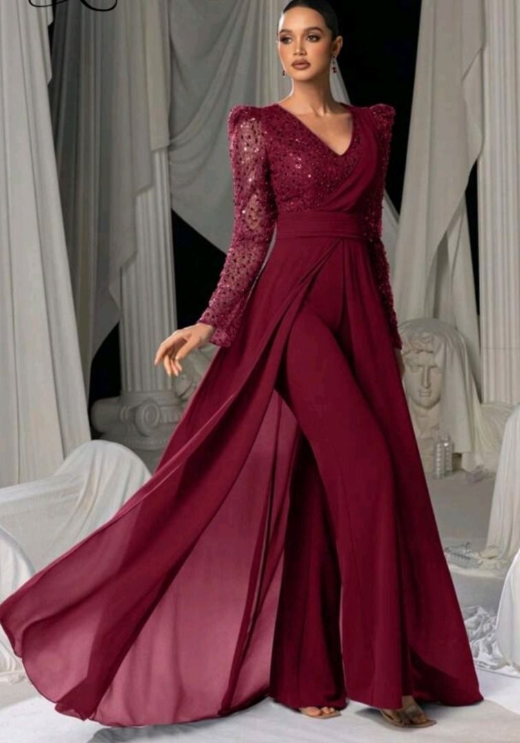 Maroon Sequenced Long Sleeve Jumpsuit with Chiffon Overlay (Category: Jumpsuits) located in Marikina City. Submitted by julysapparel_40 (Listing ID 1465825455, Image 2). Description: - Color: Maroon - Style: Long sleeve jumpsuit with a flowing chiffon gown overlay and wide-leg trousers - Details: Sparkling sequins on the bodice and sleeves, V-neck cut, and fitted waistline - Movement: Creates a dramatic and elegant flow when walking - Occasion: I