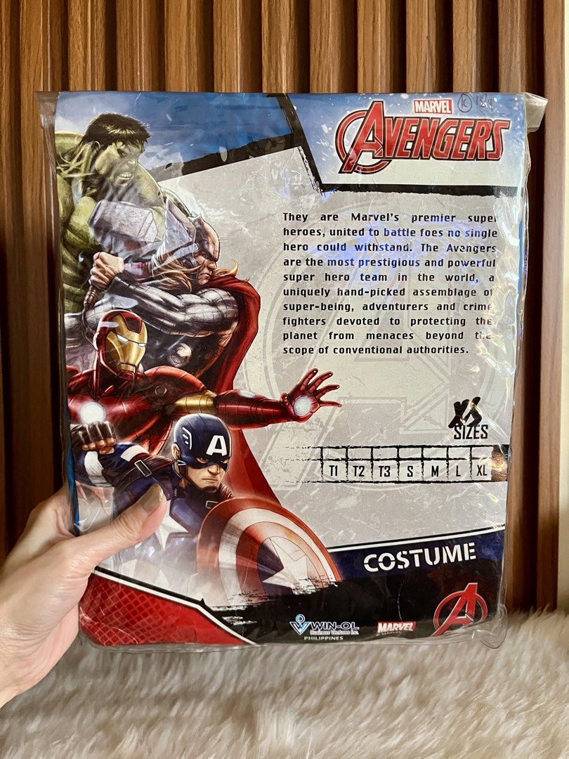 Marvel Avengers Captain America Costume (Category: Babies & Kids Fashion) located in Navotas City. Submitted by mommybabyc (Listing ID 1465876475, Image 2). Description: - Official Marvel Avengers Captain America costume - Brand new in original packaging with hanger intact - Includes iconic blue top with white star and striped lower section - Features official Avengers graphics on packaging back - Multiple size options available.