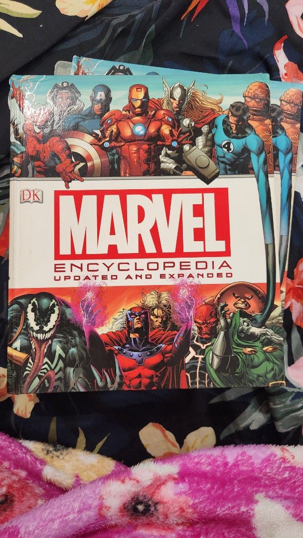 Marvel Encyclopedia Updated And Expanded Hardcover Book (Category: Comics & Manga) located in Manila. Submitted by bookchetera (Listing ID 1465845550, Image 1). Description: - Marvel Encyclopedia (Updated & Expanded Edition) - Hardcover book with stunning comic art - Features profiles for heroes (Spider-Man, Iron Man, Thor, FF) and villains (Doctor Doom, Venom) - Clean pages and solid, durable binding - Essential reference guide and bookshelf add