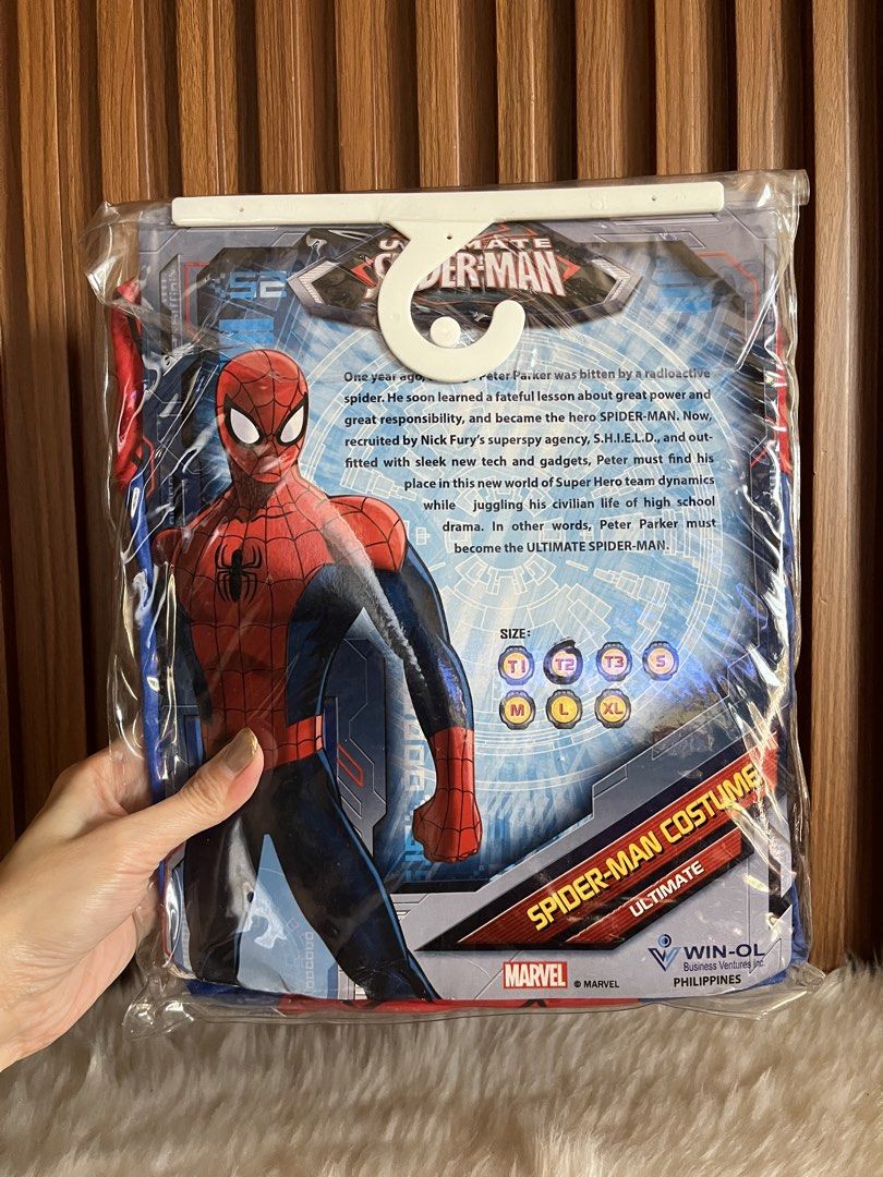 Marvel Ultimate Spider-Man Costume Size T3 (Category: Babies & Kids Fashion) located in Navotas City. Submitted by mommybabyc (Listing ID 1465874829, Image 3). Description: Marvel Ultimate Spider-Man costume set. Includes full body suit, mask, and gloves. Red and blue design with black spider logo on the chest. Still in original plastic packaging with hanger and tags attached. Win-Ol Business Ventures, Philippines manufacture. Size T3 marked on t