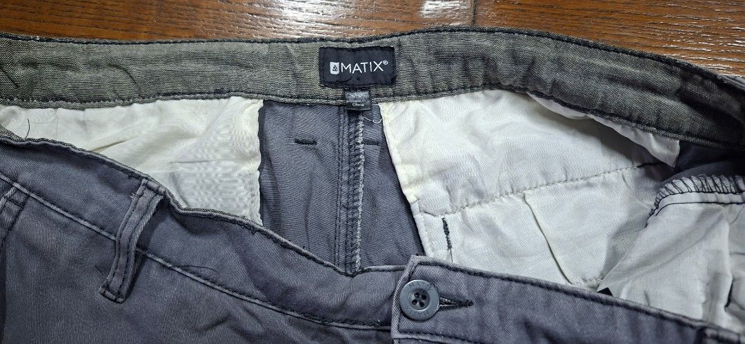 Matix Grey Casual Shorts (Category: Shorts) located in Manila. Submitted by declutrredgoods (Listing ID 1465938131, Image 3). Description: - Brand: Matix -Size: 33 - Color: Grey - Style: Casual everyday shorts - Closure: Front button with belt loops - Pockets: Two front pockets and one rear pocket with button flap - Details: Clean inner waistband lining and solid construction.