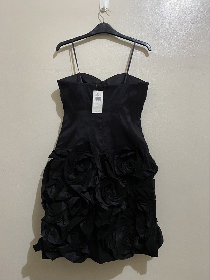 MAX AND CLEO Black Textured Mini Dress (Category: Dresses) located in Manila. Submitted by victory_1816 (Listing ID 1465918242, Image 1). Description: A sophisticated little black dress featuring a beautifully fitted bodice, delicate spaghetti straps, and a textured skirt finished with feminine ruffled rosette detailing. Brand new & never worn, with original tags attached. Features a built in in padded bust for added support and coverage, allowin