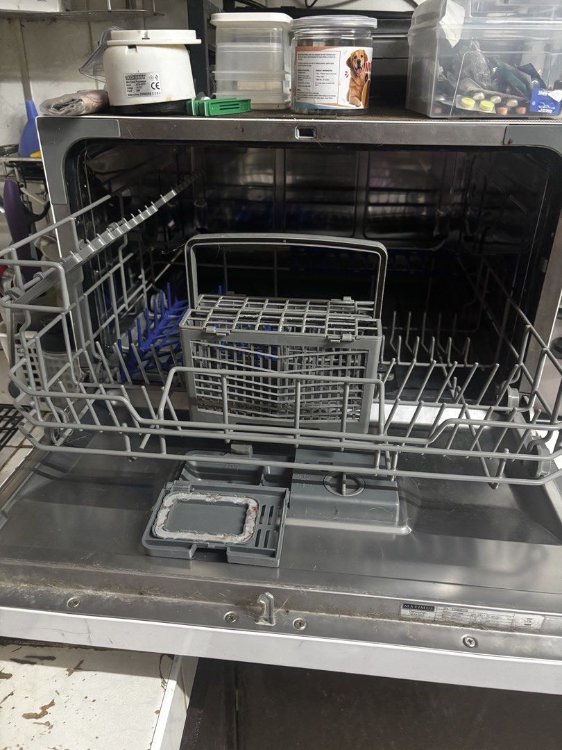 Maximus Countertop Dishwasher (Category: Dishwasher) located in Makati City. Submitted by bbnski (Listing ID 1465928554, Image 3). Description: - Brand: Maximus Countertop Dishwasher - Color: White with a chic wooden accent handle - Ideal for: Small kitchens, apartments, and condo living - Inclusions: racks and cutlery basket ( will include free dishwashing soap) - Condition: Good working condition; interior cavity and door just need a quick wipe