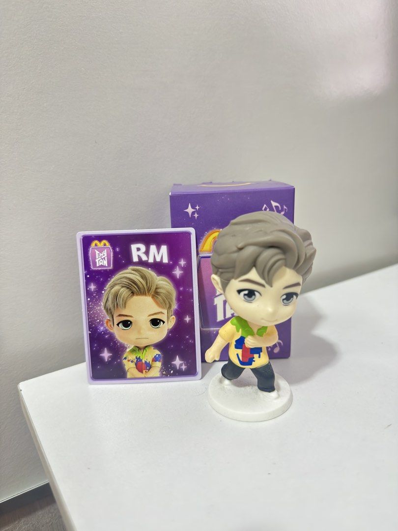 McDonald's TinyTAN RM Figure with Card and Box (Category: Designer & Blind Box Toys) located in Quezon City. Submitted by hooniecart0 (Listing ID 1465901542, Image 1). Description: - Official McDonald's BTS TinyTAN collectible figure (RM) - Includes matching photocard and iconic purple box - Comes with original white circular base - Selling as a complete set - Must-have for BTS collectors and ARMY.